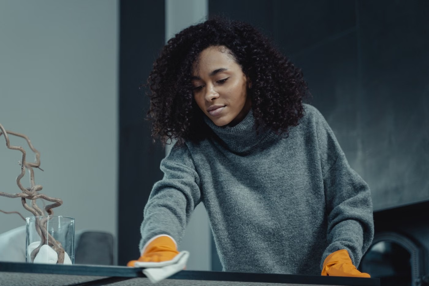 Illustrative stock photo of a woman wiping a surface in a home